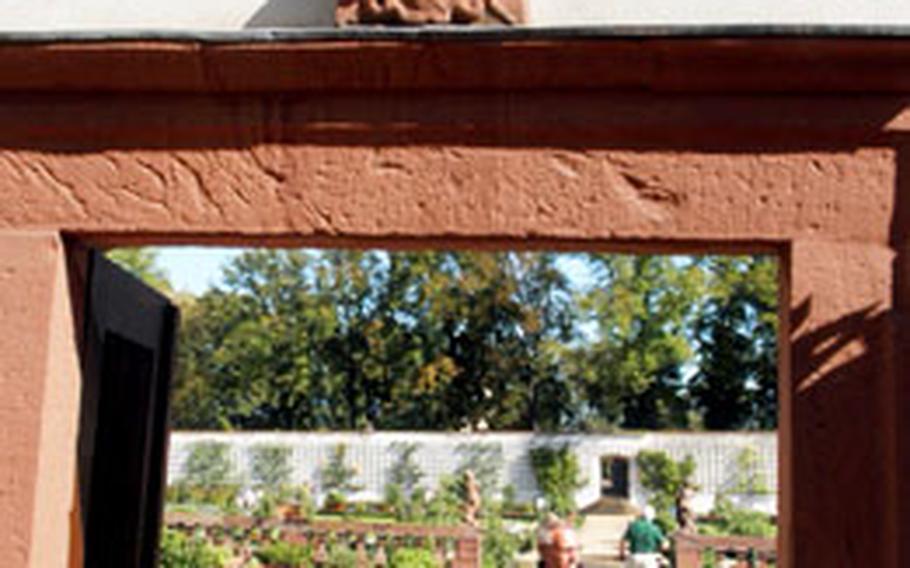 The entrance to the park and garden of the Benedictine abbey is a Baroque stone archway.