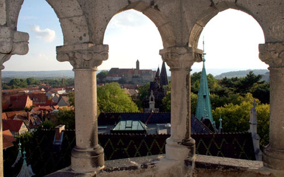 Quedlinburg, Germany, a town of half-timbered buildings, old churches and an ancient castle, sits on the edge of the Harz Mountains and is a good base for exploring the mountains and their witch tales. This shot shows the abbey of St. Servatius from a guard tower of the old town wall.