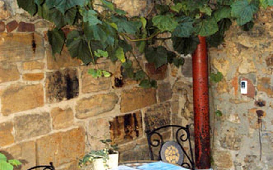 A welcome note on a little table at the Café le Grand Malheur offers customers a seat to rest and if the owners are around, a free drink.