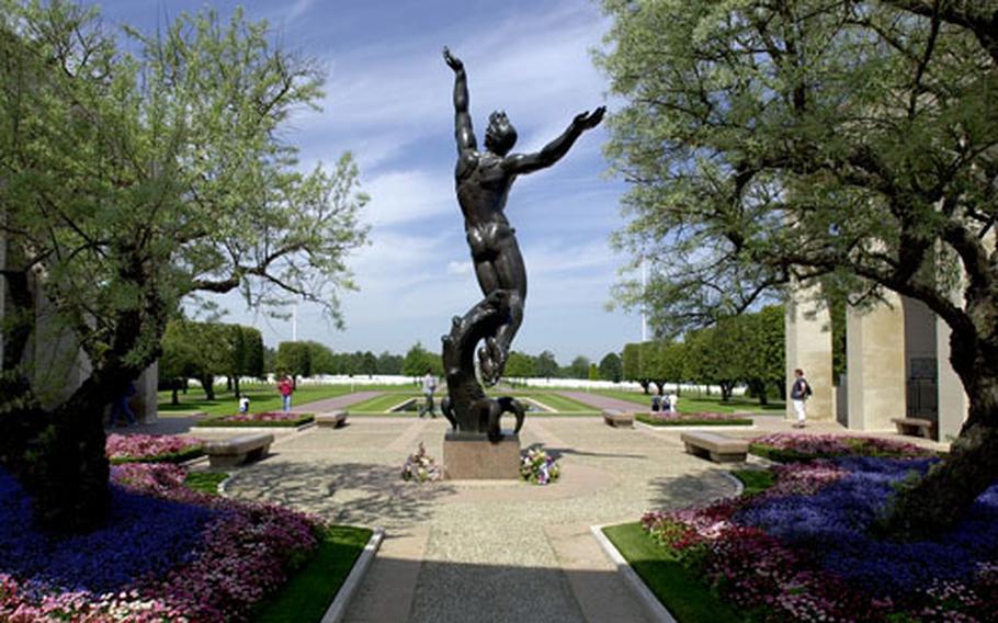 The statue "Spirit of American Youth" rises up from the memorial at Normandy American Cemetery, above the D-Day landing sites at Omaha Beach. It is one of the American cemeteries in Europe that will be holding Veterans Day ceremonies this weekend.