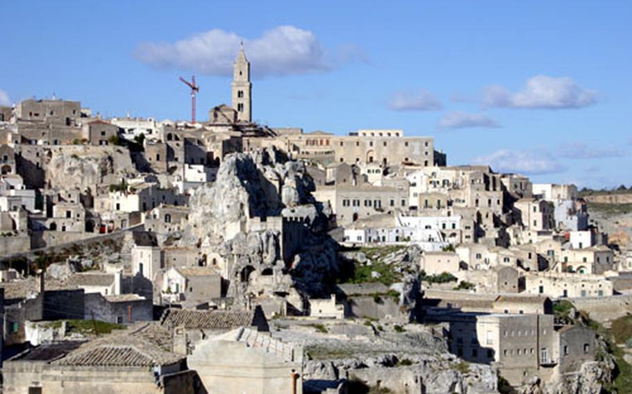 The Sassi district of Matera is a network of dwellings carved into the tufo rocks and limestone of the mountainside, or built on top of the rock and one another.
