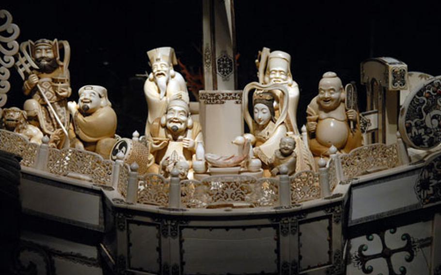 The 19th-century masterpiece “Ship of Luck,” one of the largest pieces on display at the museum, features the Japanese seven gods of luck.