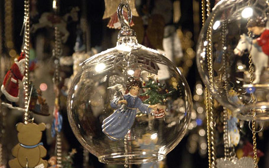 A tin angel flies in this Christmas tree ornament on sale at the Christmas market in Basel, Switzerland, last year.