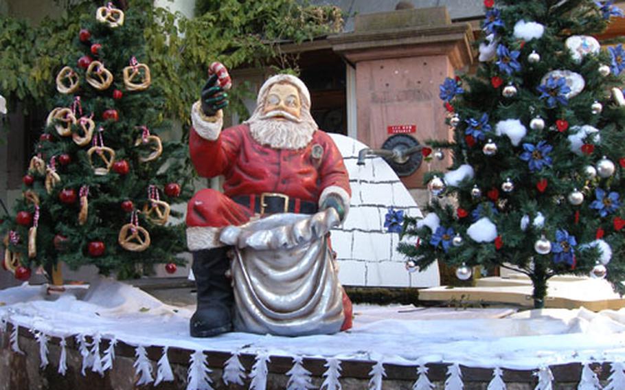 Santa, or Pere Noel as he is called in France, on a fountain in Riquewihr, France.