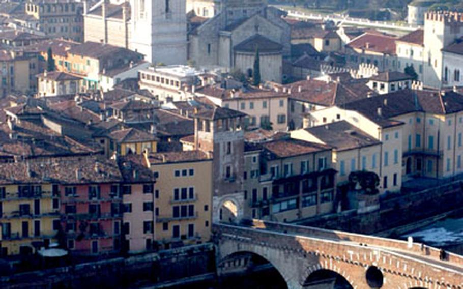 The Duomo (cathedral) and Ponte Pietra (stone bridge) are clearly visible from the foot of the Castel San Pietro, which sits on a hill towering over much of Verona, Italy.