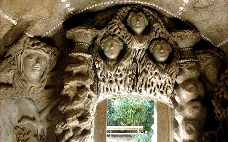 A grotto inside the Palais Idéal is decorated with human faces.