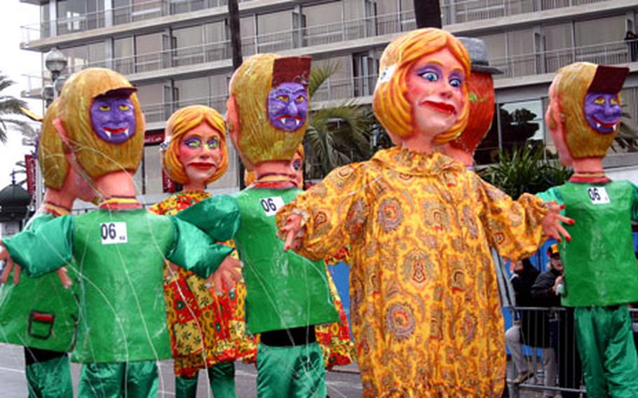 The two-faced, papier-mâché heads depict people&#39;s duplicity: they have smiles on one side and monsters&#39; faces on the other. The characters fit in the 2006 Nice Carnival theme of "dupery."