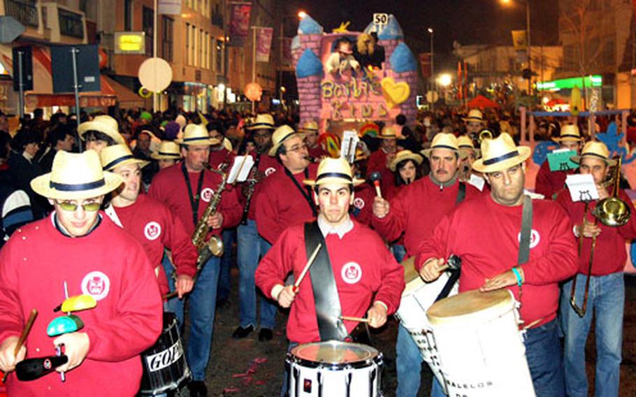 A samba band in Torres Vedras keeps a driving rhythm going deep into the night. Participants often will dance until they drop from exhaustion.