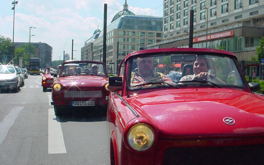 A group of Trabants filled with tourists heads out on a Trabi-Safari through the streets of eastern Berlin. The self-drive tours, coordinated over the cars&#39; radios by a guide, takes participants past sights in the formerly Communist-ruled part of the city.
