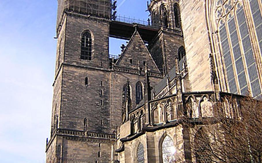 Scaffolding covers the top of one of the towers near the main entrance of the Magdeburg cathedral, the Cathedral of St. Mauritus and St. Catherina. The 13th century cathedral is one of the first Gothic cathedrals built in Germany.