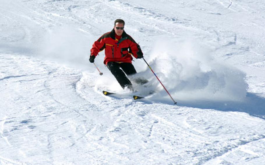 Bavarian Ski Club member Chris Lawton skis a black run at Saalbach Hinterglemm, Austria.