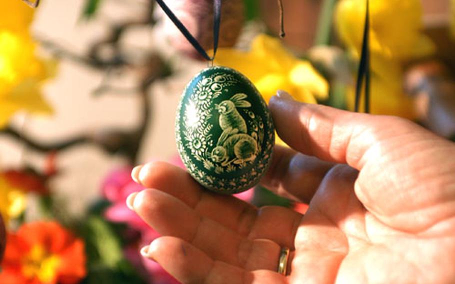 An easter egg with a floral and rabbit design carved into it on sale at the Easter egg market in Seligenstadt, Germany. Another market will be held at the monastery there this weekend.