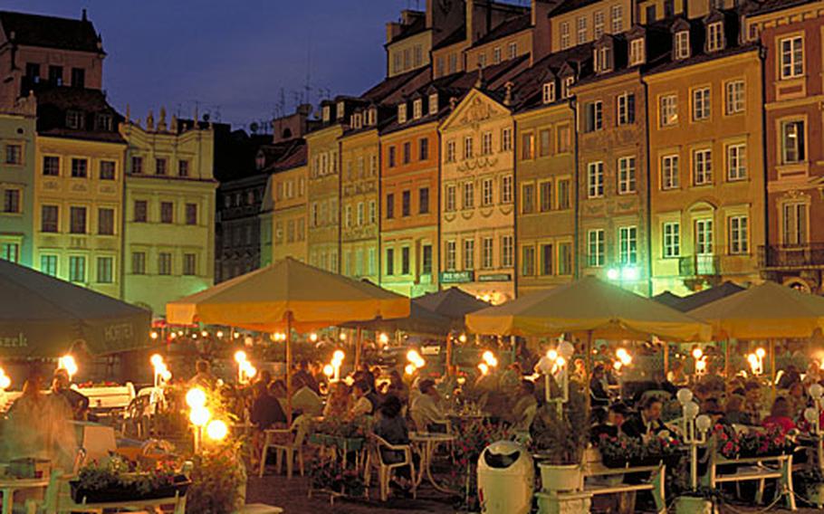 Warsaw’s Old Town Square charms at night.
