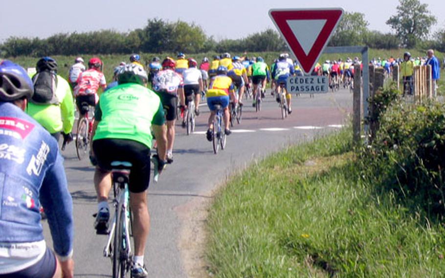 Cyclists round a bend in Normandy, France, during last year’s Voie de la Liberté. More than 300 riders, including a contingent from U.S. military communities in Europe, participate in the annual tour.