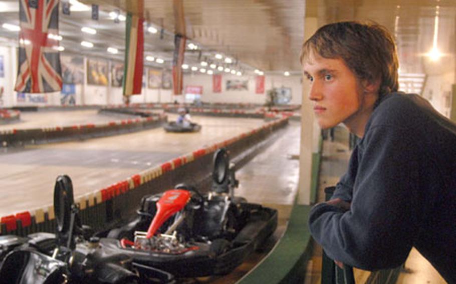 American Wesley Hrushka watches go-carts speed by as he awaits his turn to drive at Erfenbach’s indoor go-cart track, Go! Indoor Kart. The track’s top cart is capable of 65 kilometers per hour on the tight twisty track, giving the speed enthusiast more than a good time.
