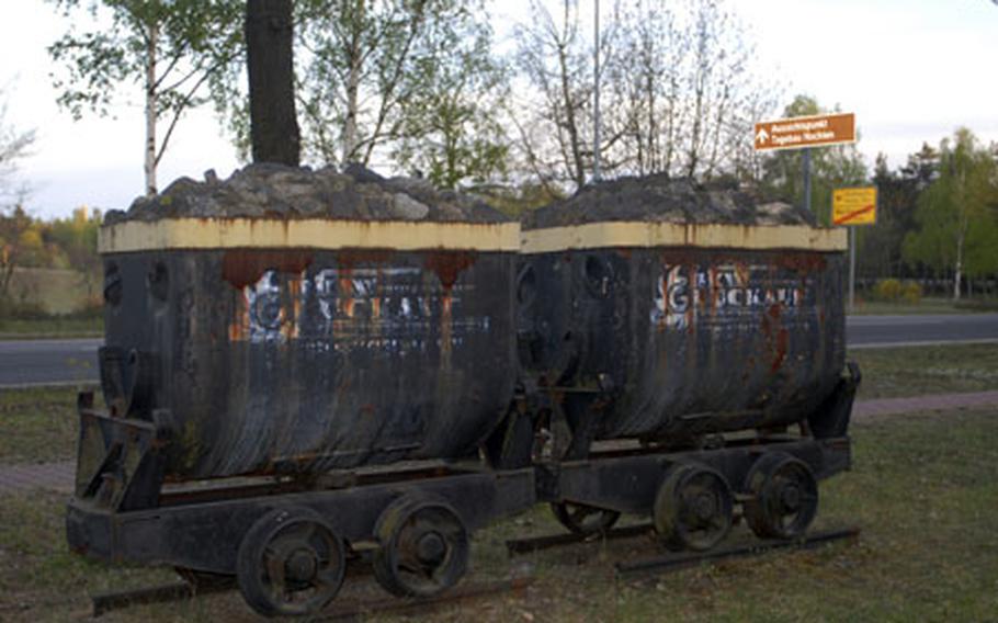 Old coal mining equipment is a reminder of Weisswasser&#39;s past and present economic heart.