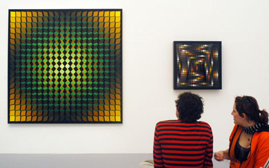 A couple enjoys a work of French artist Yvaral at the optical art exhibit at the Schirn Kunsthalle in Frankfurt.