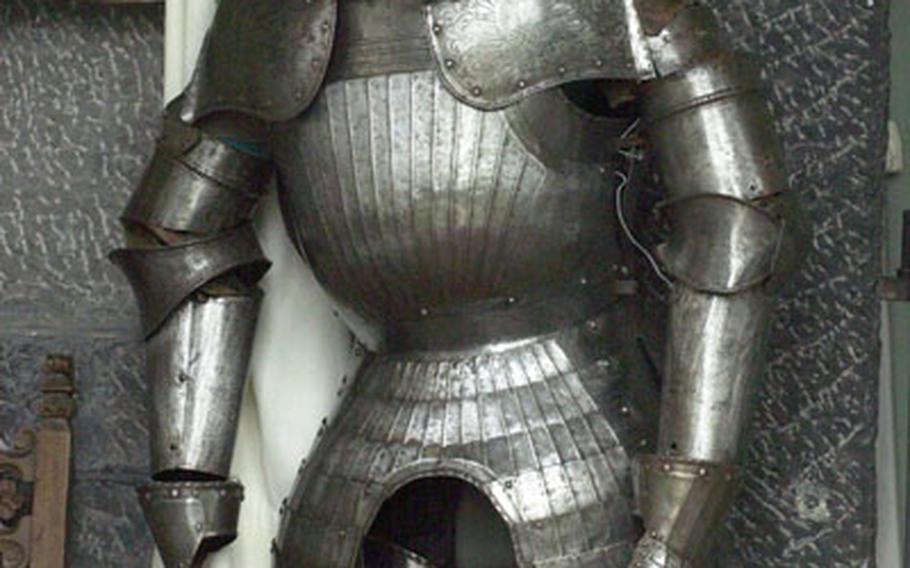 A suit of armor stands guard at Jehay Castle in Amay, Belgium. The castle is filled with fine valuables such as paintings, antique furniture and tapestries.