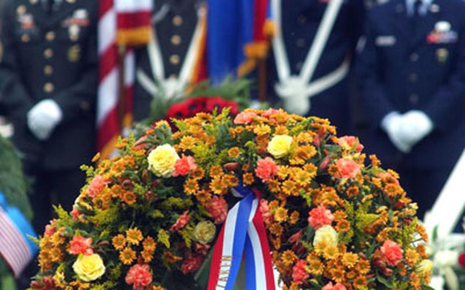 Dignitaries from several countries placed wreaths to honor U.S. servicemembers killed in World War II at a 2004 Memorial Day ceremony at the Netherlands American Cemetery and Memorial in Margraten.