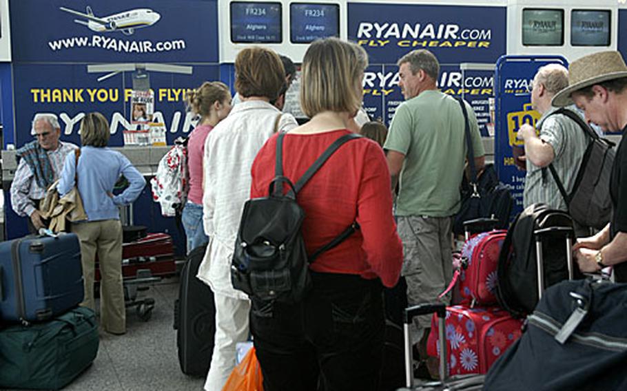 Ryanair passengers line up to check in for a flight at London&#39;s Stansted airport recently.