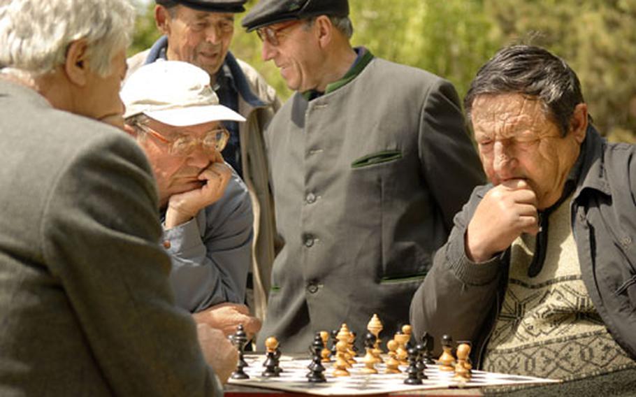 Town elders, adorned in clothes reminiscent of a different time, congregate in Constanta’s central park for conversation or a game of chess.