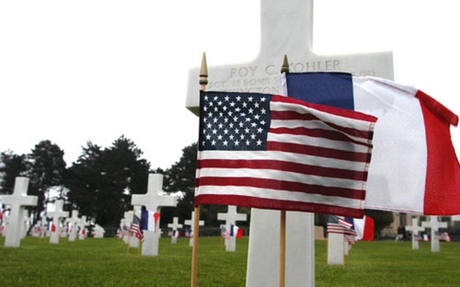 Grave markers at the Normandy American Cemetery, where 9,387 U.S. troops killed in the Allied invasion of Normandy are buried, were decorated with U.S. and French flags for the 63rd anniversary of D-Day.