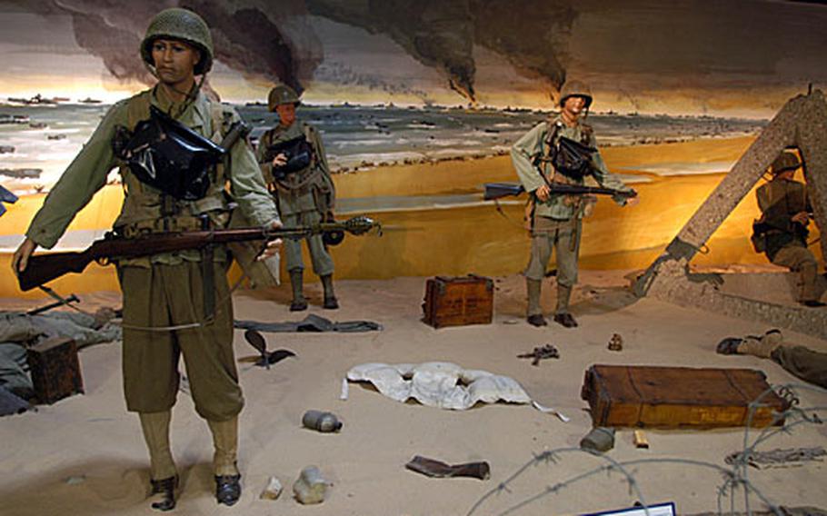 Exhibits at the Musée Memorial d' Omaha Beach cram World War II memorabilia into scenes as they try to re-create the American landing on D-Day. The museum, though not the biggest dedicated to the Normandy invasion, nevertheless has an impressive collection of both U.S.and German weapons, vehicles, clothing and equipment.