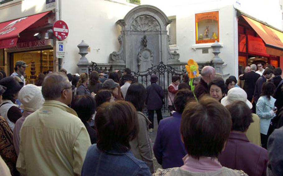 The Manneken Pis is must-see for many tour groups. On some days, you have to fight your way to the fence for a close-up view.