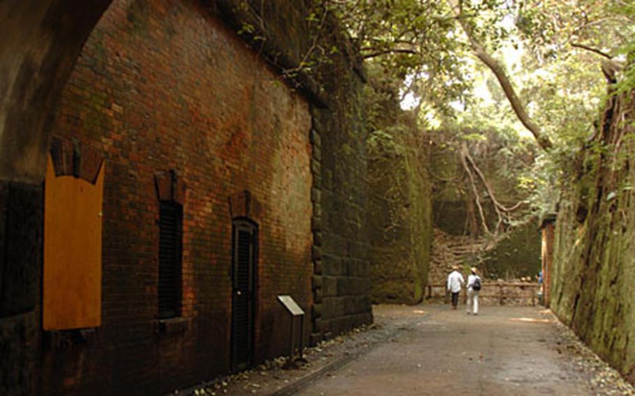 A Japanese couple visits the World War II bunkers that remain on the island for tourist to enjoy. Monkey Island is an ideal vacation spot located off the coast of Yokosuka, Japan.