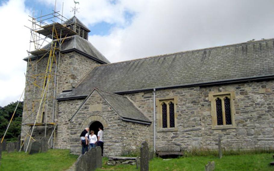 Roof repairs at St. Melangell’s Church in Pennant Melangell, Wales, are no hindrance to visitors and pilgrims who come to the site. Restoration of the church was completed in the 1990s. A local parish maintains the building, aided by donations.