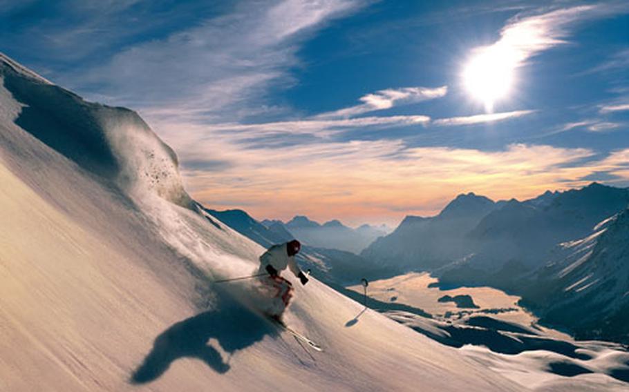 A skier&#39;s dream: Dramatic landscapes and fresh powder, such as this skier is enjoying in the Corvatsch area of Switzerland.