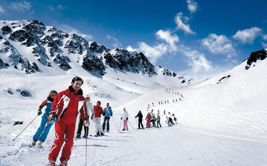 An instructor leads a skiing class in Val Schlattain in Corviglia, above St. Moritz.