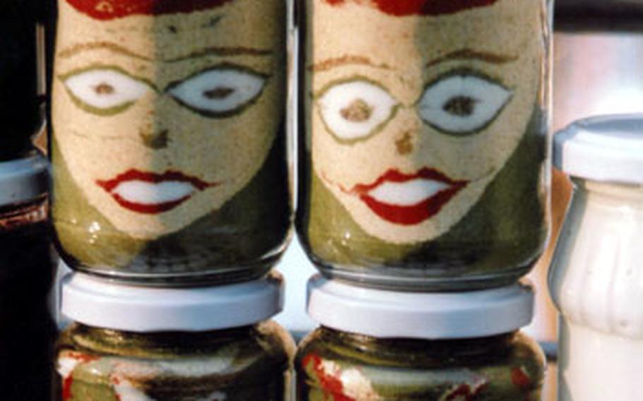 An herb and spice mixture of Chubritsa, a Bulgarian herb, red pepper, basil, oregano, black pepper, cumin and salt, is artistically poured into jars to create images of people, animal and scenes. Bread is dipped into the mixture as an appetizer. It’s also used on grilled meats.