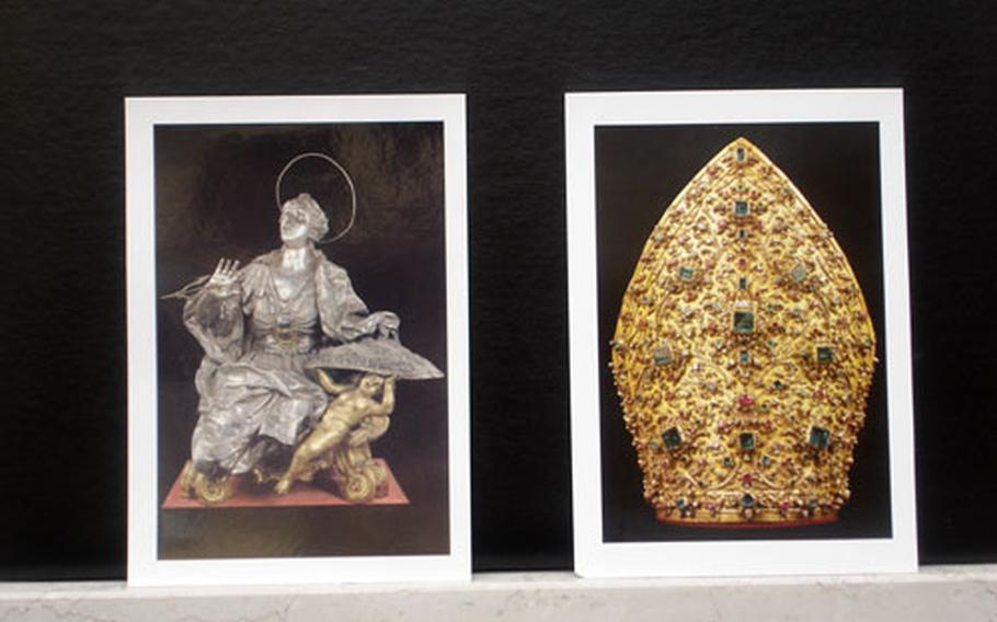 Postcards depicting St. Irene and a gold, gem-encrusted miter -- two pieces of the San Gennaro Treasure collection on display in Naples -- are among the exhibit items available in the museum&#39;s gift shop.