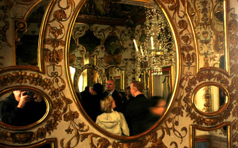 A decorated mirror allows visitors to reflect on the detailed craftmanship visible throughout Germany’s Ludwigsburg Palace.