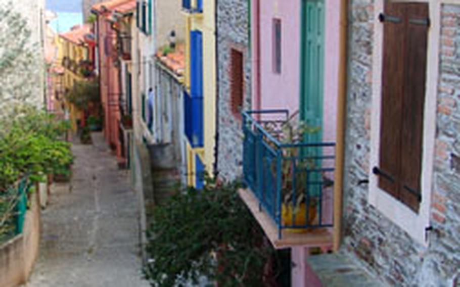 The narrow lanes of old town Collioure are lined with restored townhouses in bright pastels. The town is south of Perpignan on the coastal road to Spain.
