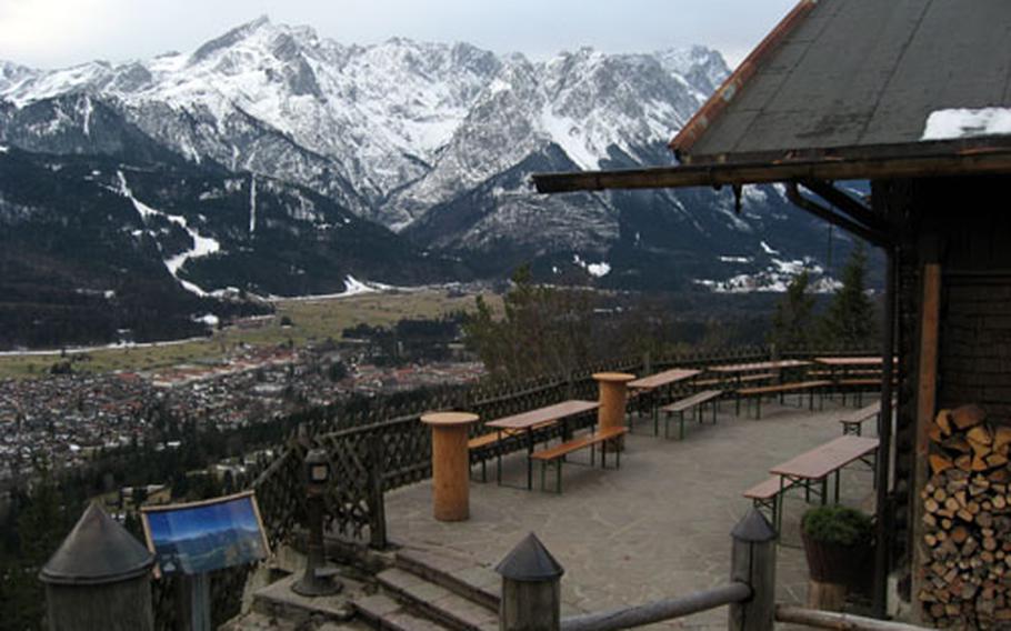 The patio at Saint Martin Hütte in Garmisch, Germany, offers good views of the village in the valley and some of the high peaks of the Bavarian Alps in the background.