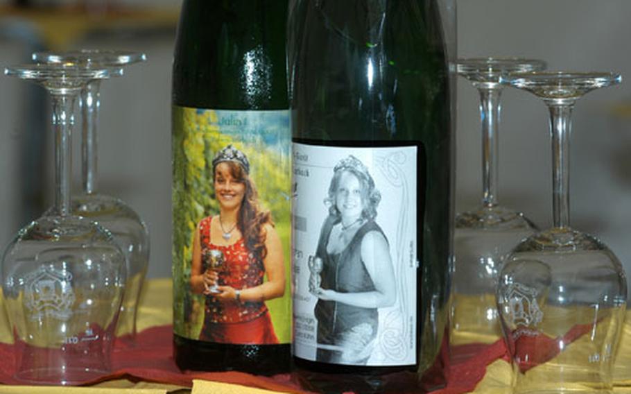 Both Julia Bitsch, left, the retiring wine queen, and Cora Kühn, 20, the new wine queen of Traben-Trabach, Germany, are honored on their own wine labels.