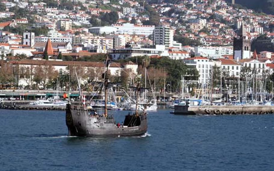 A replica of one of Christopher Columbus&#39; ship, the Santa Maria, passes the capital city of Funchal on its daily trip to spot whales and dolphins.-