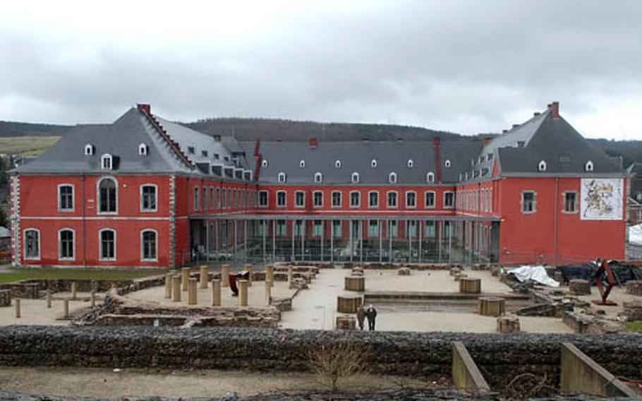 The former abbey at Stavelot, Belgium, houses three museums, an art gallery and a tourist information office. In front of it are the ruins of the abbey church.