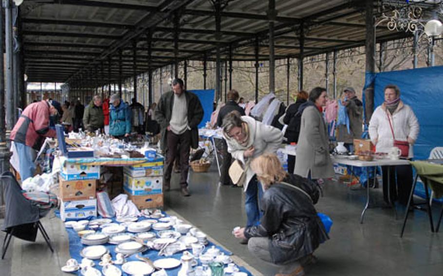 Visitors check out the goods at the Spa flea market. It takes place every Sunday morning in the Sept Heures park, behind the tourist office.