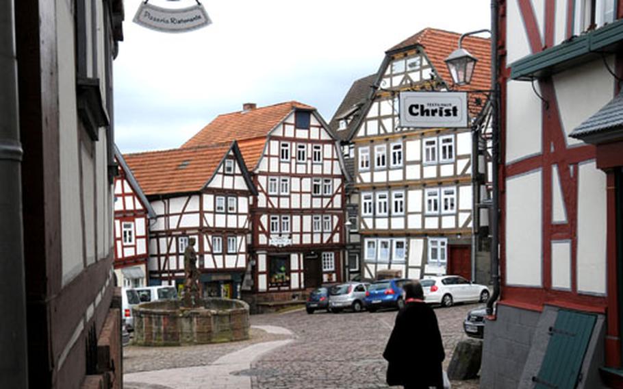 The market square in the old town of Schlitz, Germany, is surrounded by half-timbered houses.