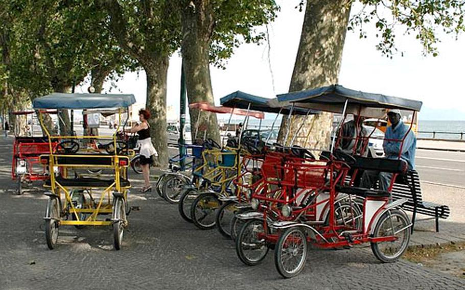 Rickshaws for rent along Riviera di Chiaia.