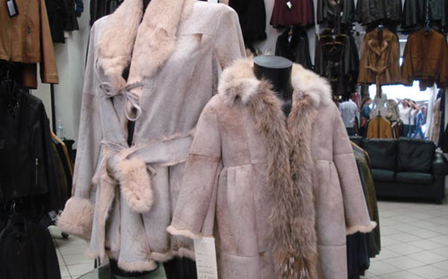 Like mother-like daughter: one store in Florence displays matching suede and fur-trimmed coats.