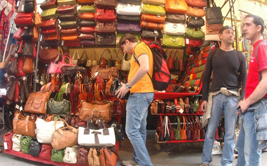 Leather bags are the main feature at this stall, one of many found in Florence’s leather market. Leather goods are sold at stall and shops throughout the city.
