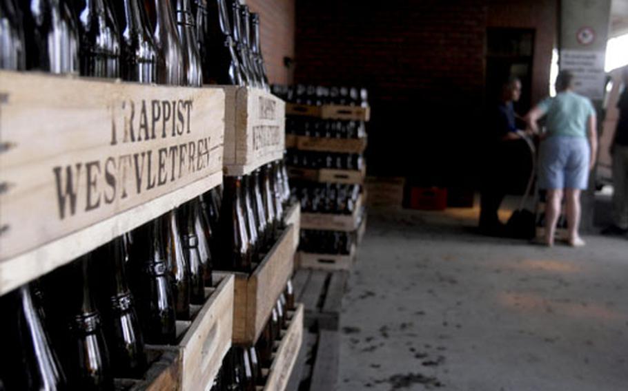 Simple wooden crates and empty bottles of the Saint Sixtus beer sit in the loading/unloading area. The highly-sought-after beer runs 33 euros per case plus a 12-euro deposit for the crate and empty bottles.