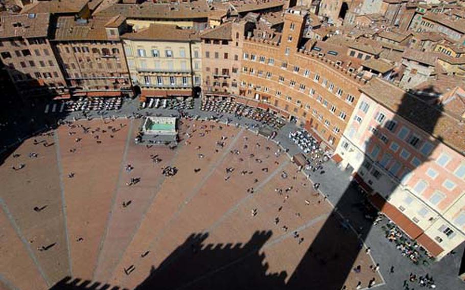 Siena&#39;s Piazza del Camp, where the famous Palio horse race takes place. This photo was taken from the Torre del Mangia, the tower of Siena&#39;s Gothic city hall.