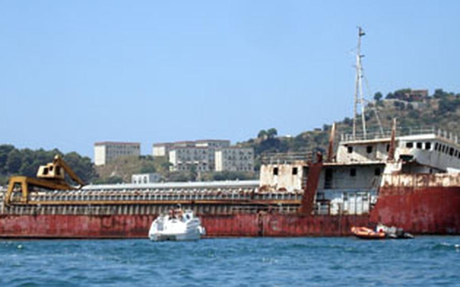 An abandoned tanker now is a familiar sight — though not a very pretty one — for beach and boating enthusiasts who visit the Baia area.