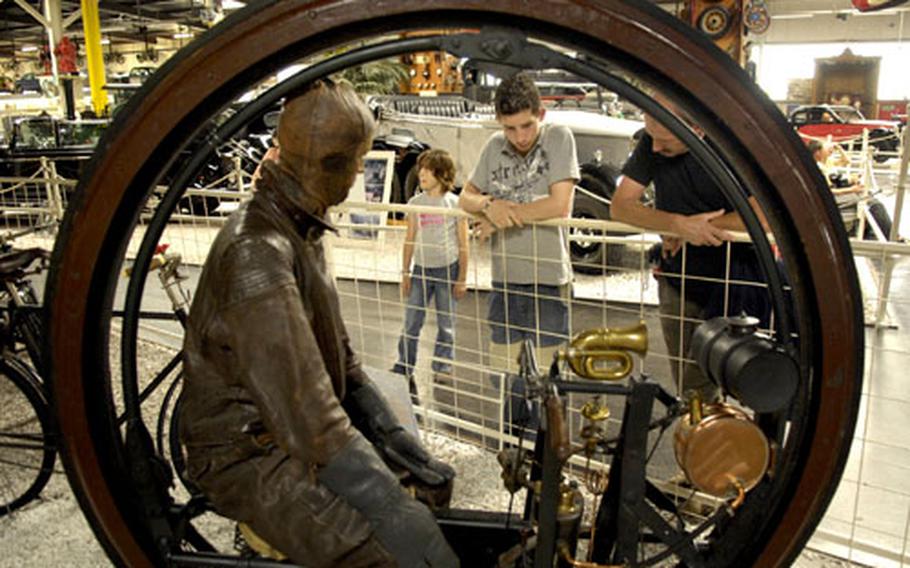 Why not ride inside the wheel? Erich Edison-Puton of Paris thought it was a good idea back in 1894. The motorized "unicycle" is one of many motorcycles on display at Sinsheim's Auto and Technik Museum.