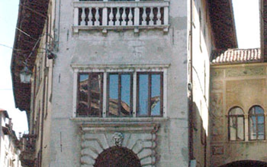 Dozens of buildings in Feltre, Italy, boast frescoes on the walls. Others, such as this one, stand out for other architectural features, such as an unusual roof.